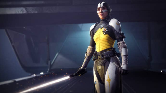 A feminine human clad in relatively low-key sci fi armour and holding a glowing sword. A lightsaber. It's Destiny 2's Star Wars crossover event.