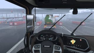 A screenshot from Euro Truck Simulator 2, showing the inside of a cab on a motorway on a rainy day. It's anything but glamorous.