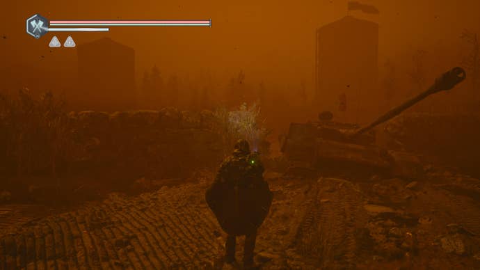 Hell is Us screenshot showing player character in a orange foggy town with ruined tank