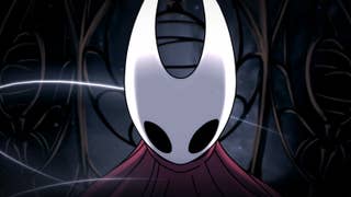 A close-up of Hollow Knight Silksong protagonist Hornet, pointed white head bowed slightly, black cavernous eyes peering out.