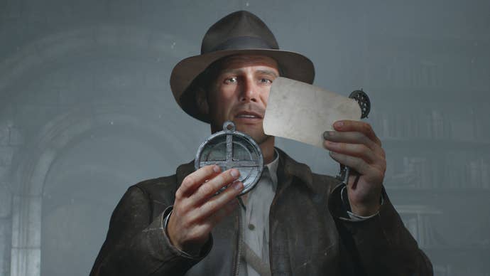 Indy looks at a note while holding a key and a disc like object in Indiana Jones and the Great Circle's DLC Order of Giants