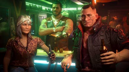 Three gruff-looking people at a neon-lit bar turn to face the camera. One is an older lady, one is a burly barman with their arms crossed, and one is a chunky leather jacket-wearing, broad-faced thug of a guy, with a beer in their hand. It's Jackie Welles from Cyberpunk 2077.
