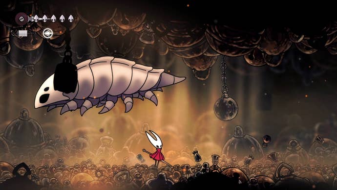 Hornet stands beneath the Bell Beast as he jumps in Hollow Knight: Silksong
