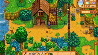 A farmer stands outside their house in Stardew Valley.